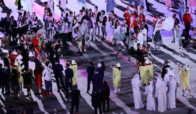 7月23日，第32届夏季奥林匹克运动会开幕式在日本东京举行。这是各代表团入场。新华社记者 兰红光 摄 1.jpg